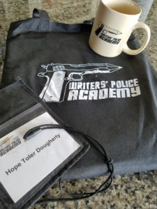 Image: Writers' Police Academy mug, bag, and nametag.