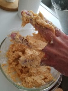 Image: Hand sticky with sweet potato biscuit dough
